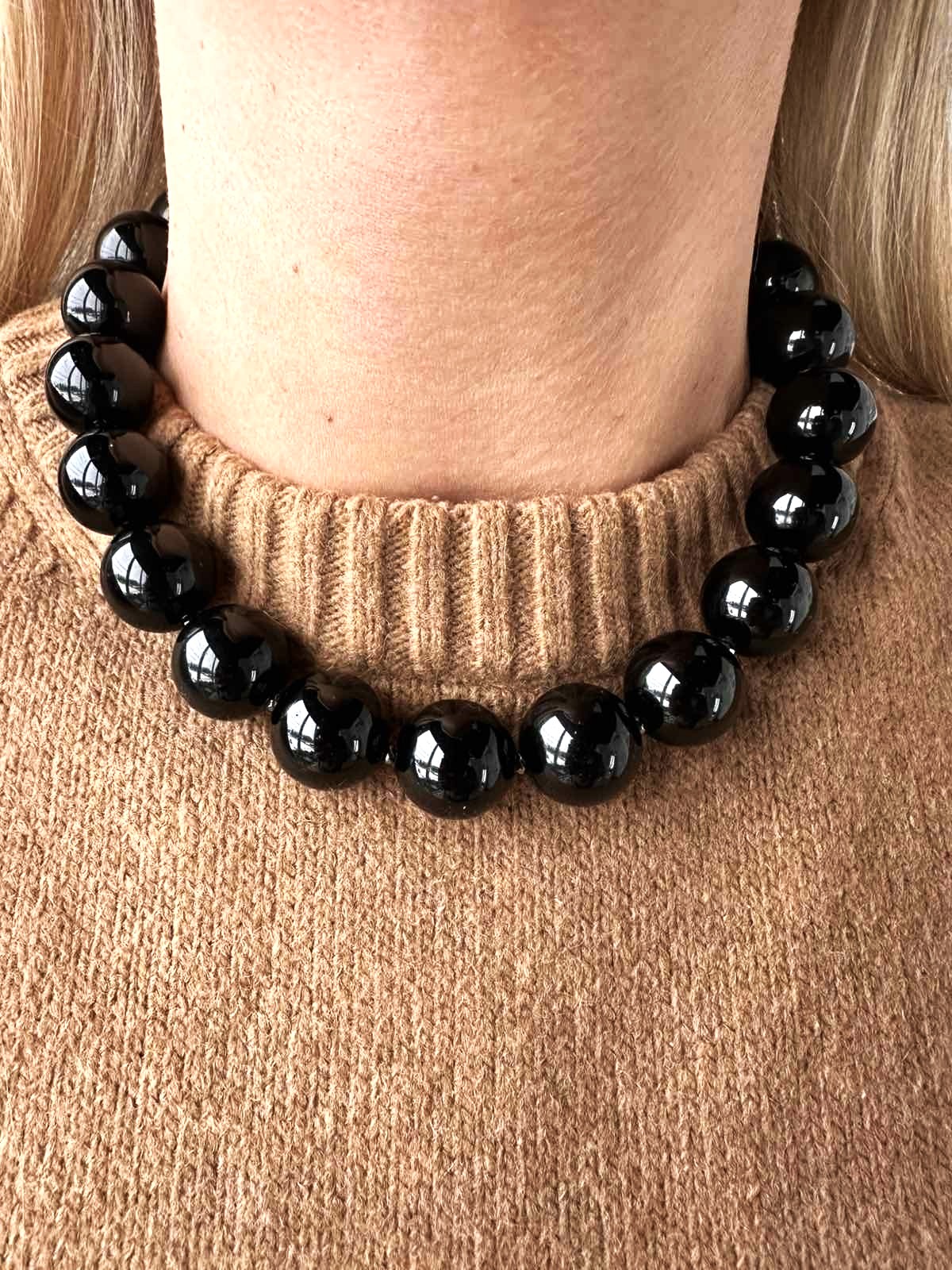 Stambus onikso vėrinys